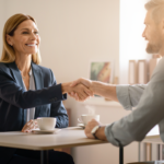A nonprofit executive director shaking hands with a marketing consultant